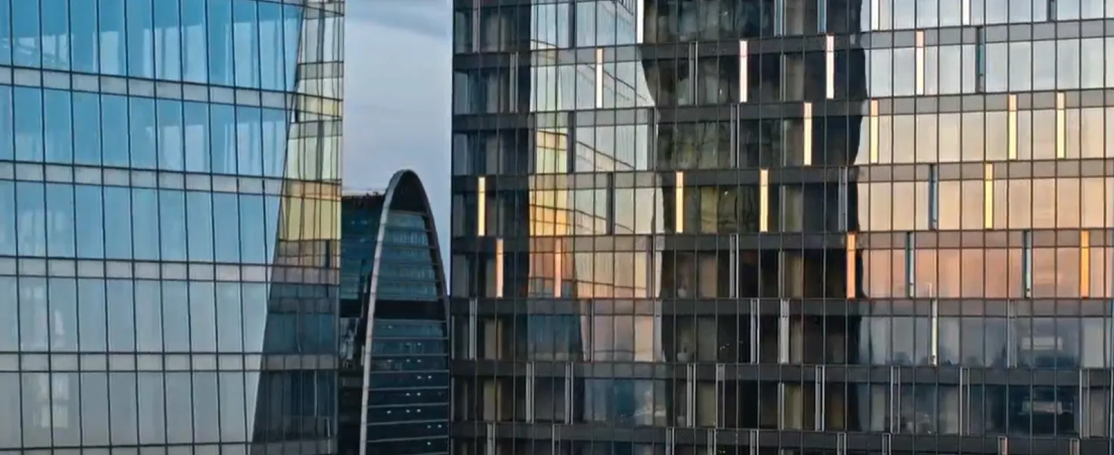 Glass skyscrapers reflecting sunset