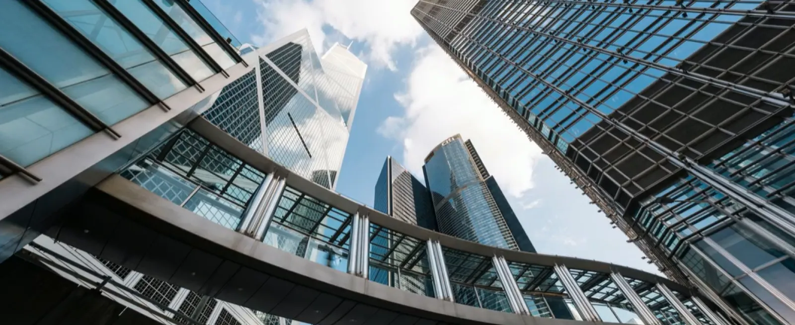 Looking upward at glass skyscrapers 